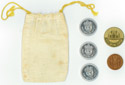 Ultima I bag and front of coins